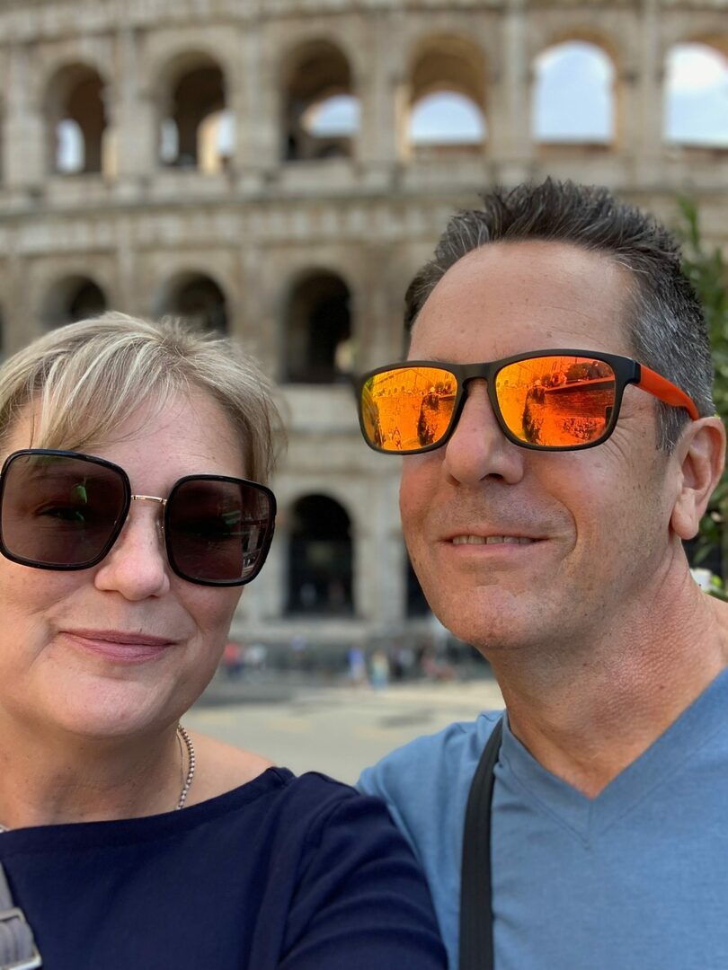 Mark and wife in front of Colosseum Rome