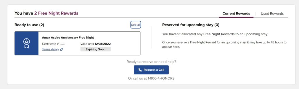 Screenshot of a hotel rewards page showing 2 free night rewards. One Amex Aspire Anniversary Free Night certificate is labeled Expiring Soon, valid until 12/31/2022. Tabs for Current Rewards and Used Rewards are visible.