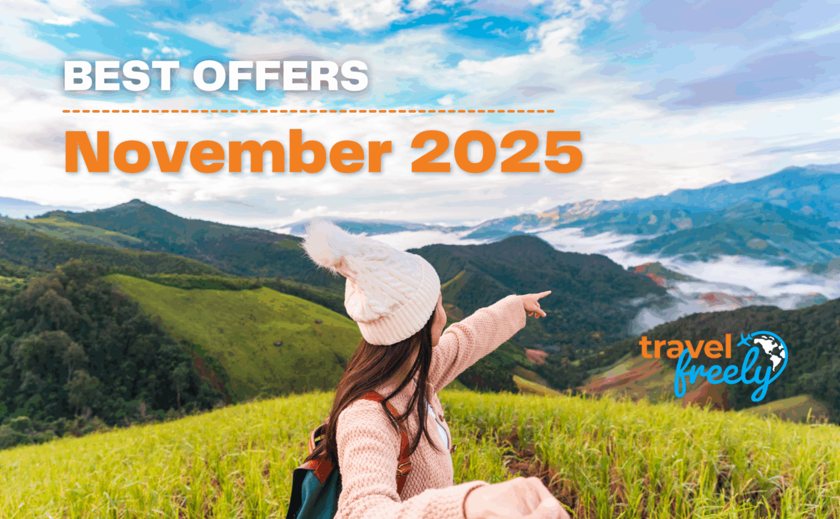 A woman in a winter hat points toward scenic mountains under a blue sky. Text reads: “BEST OFFERS November 2025.” The “travel freely” logo and a mention of the best travel credit card appear in the bottom right.